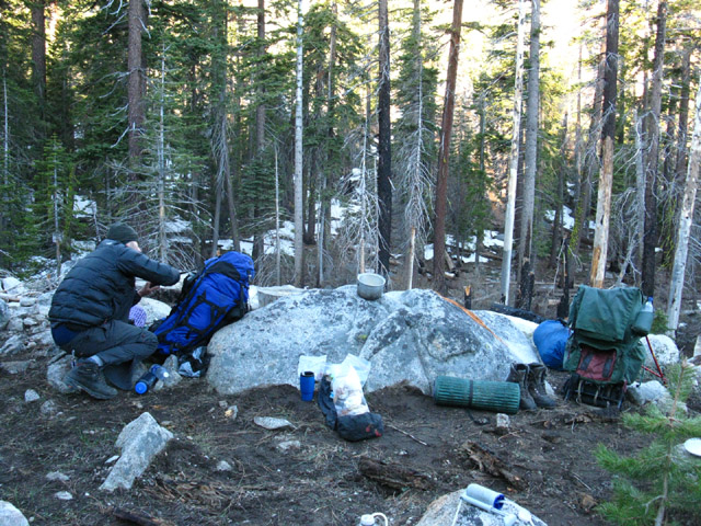 Ari getting campsite together just below snowline, Meiss Country Roadless Area, backpacking Lake Tahoe